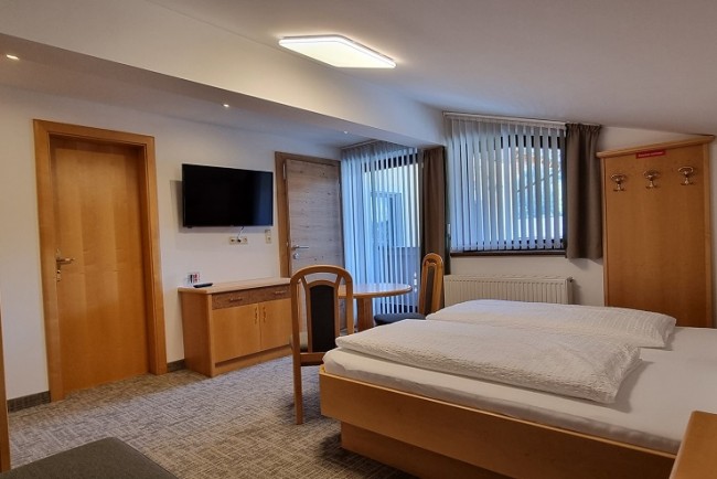 Dreibettzimmer mit Balkon