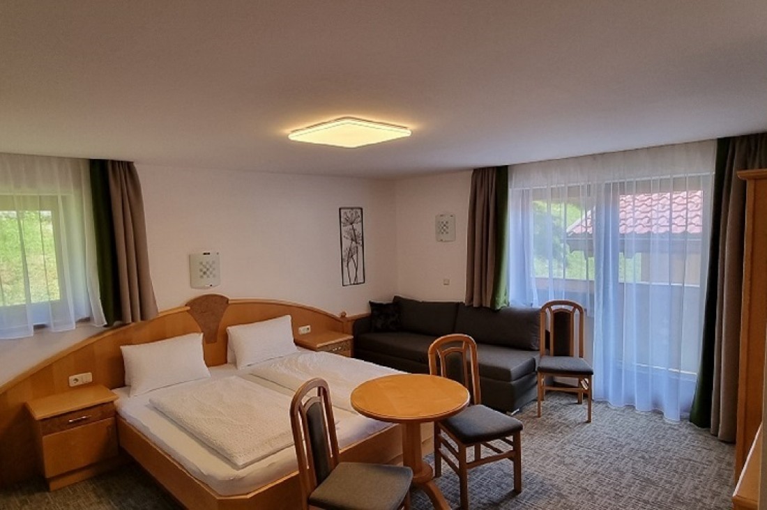 Dreibettzimmer mit Balkon
